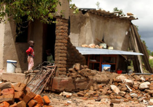 A boy looks on at a family home destroyed by floods following Cyclone Idai in Chimanimani district, Zimbabwe, on March 18, 2019. Photo by Philimon Bulawayo/Reuters