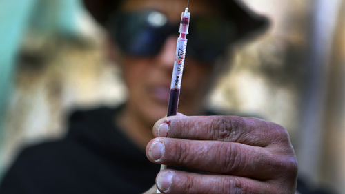 Heroin users (Yannis Behrakis, Reuters)